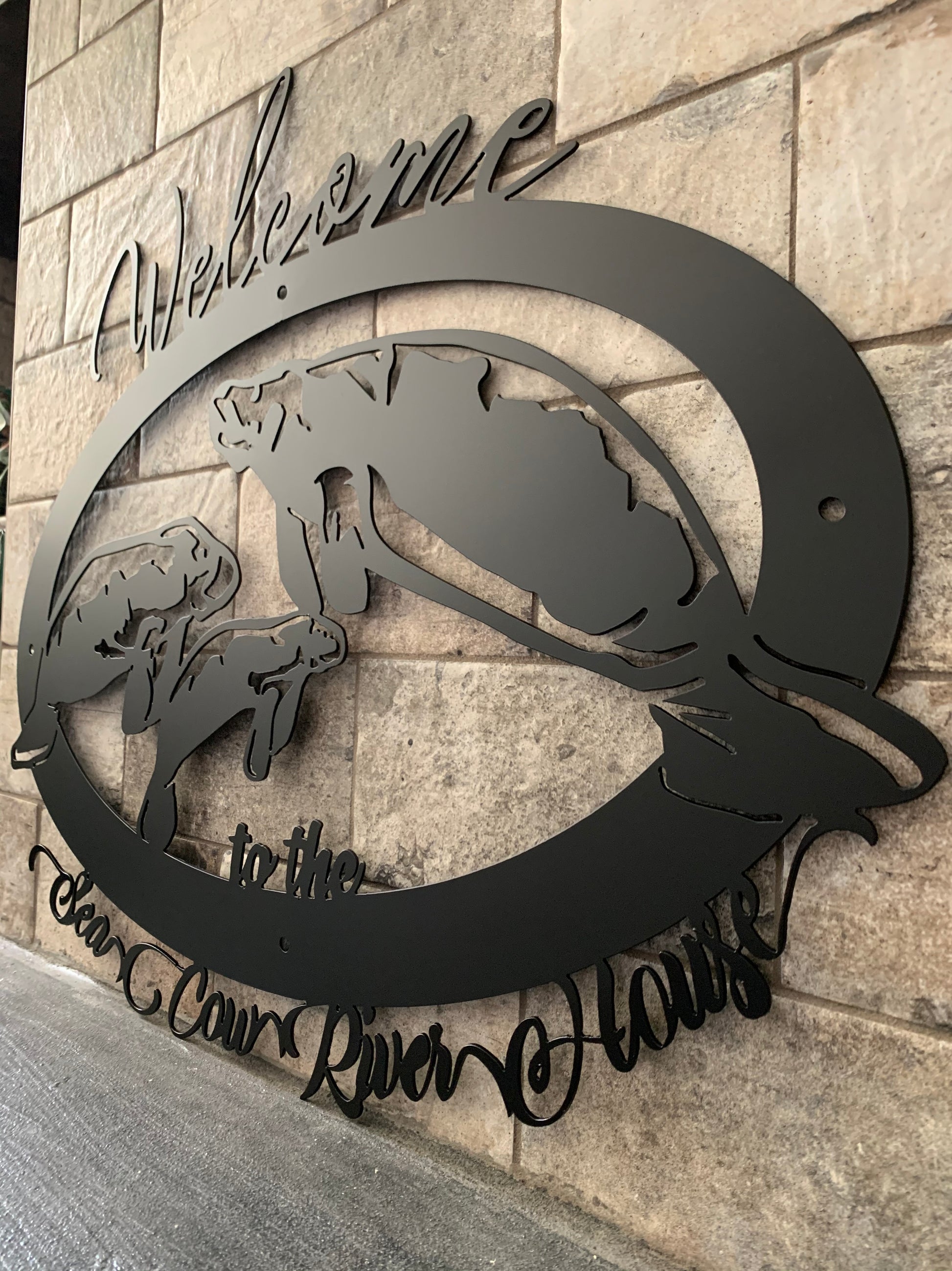 3 quarter view of 14 guage mild steel 3 manatee sign, one mamma with 2 calves  in Flat Black Powder Coat
