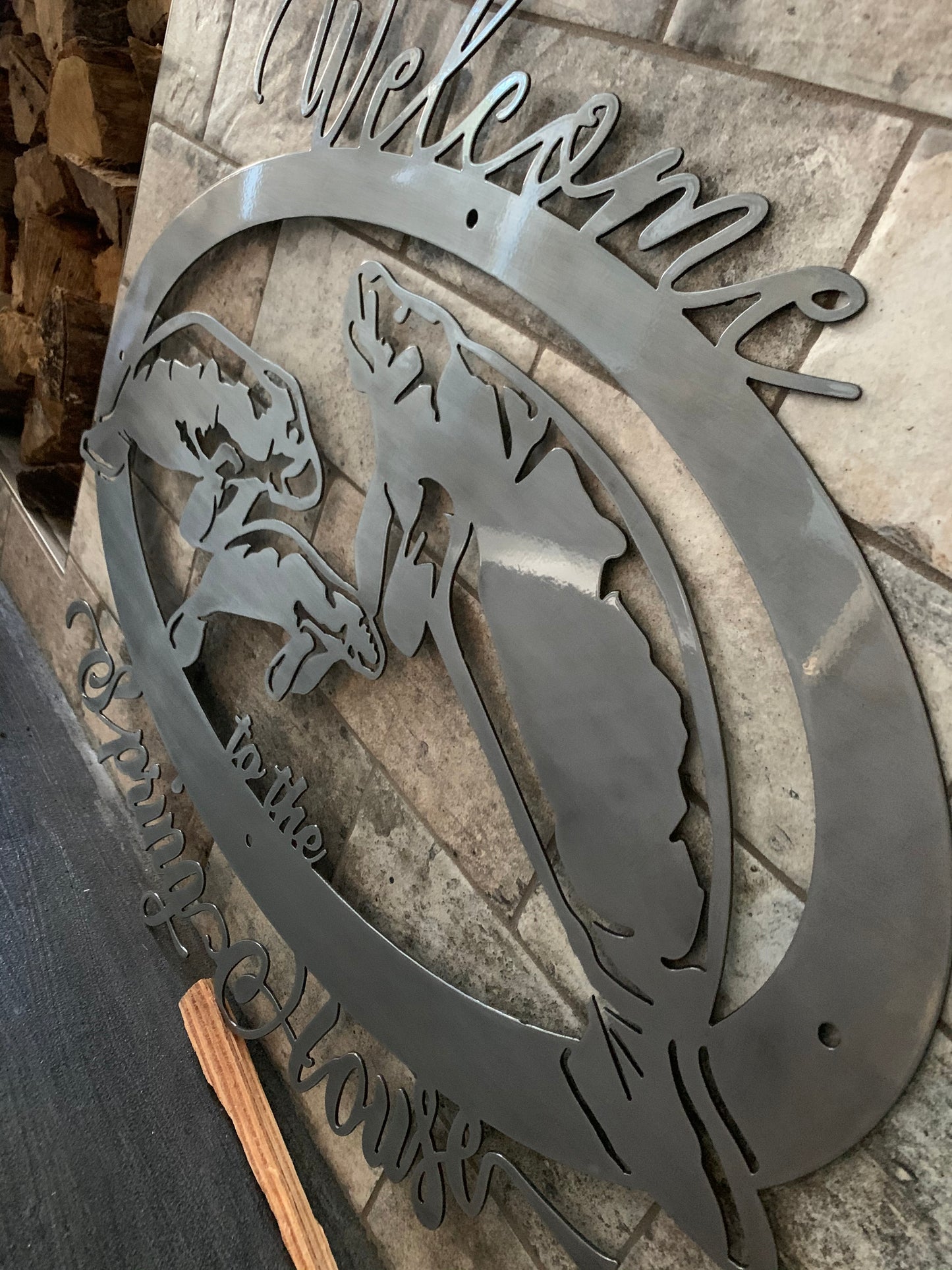 3 quarters view of brushed manatee sign